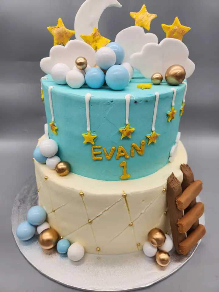 Blue starry birthday cake with name topper